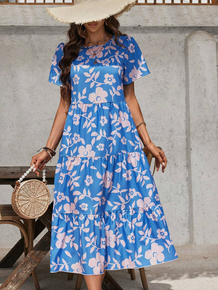 Ladies airy tiered midi dress with high waist seam, short sleeve and all-over floral pattern Mune Fashion