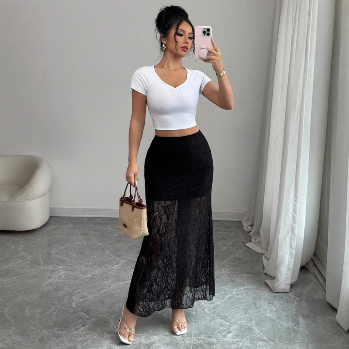Ladies high-waisted lace maxi skirt with semi-transparent insert and trumpet hem Mune Fashion