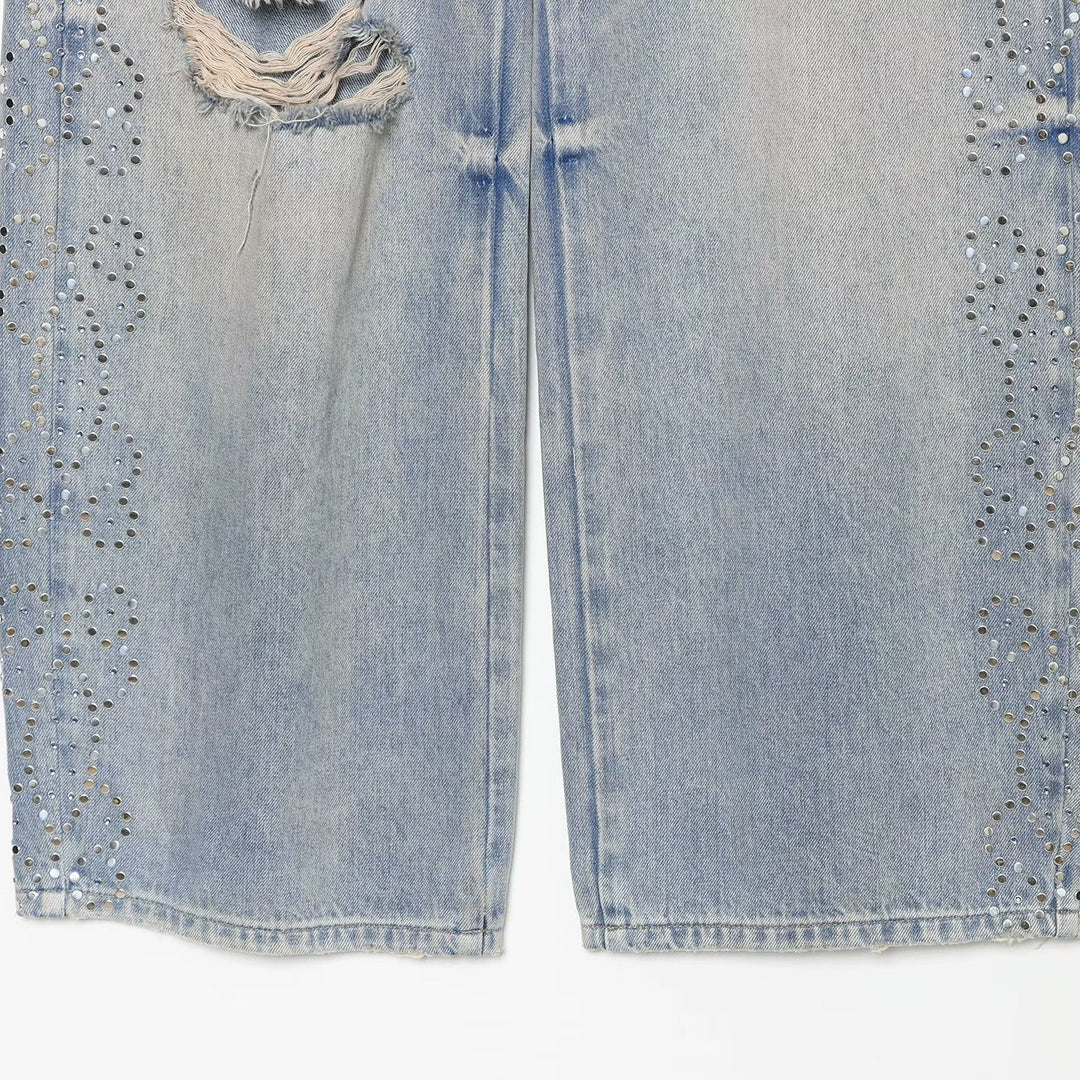Women's jeans with a high waist, wide leg, rhinestone trim, and destroyed details Mune Fashion