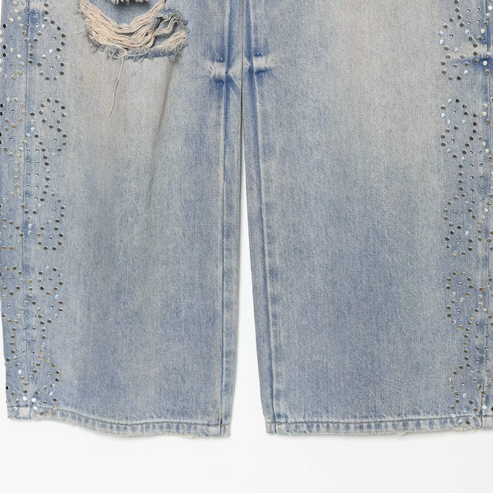 Women's jeans with a high waist, wide leg, rhinestone trim, and destroyed details Mune Fashion