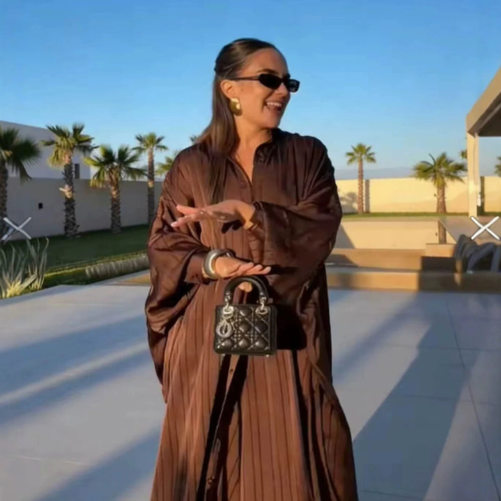 Women’s maxi dress in pleated kaftan style with oversized sleeves and button placket Mune Fashion
