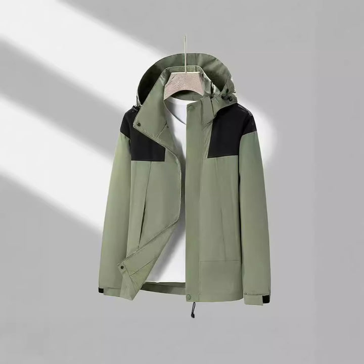 Men's lightweight softshell jacket with contrasting shoulder panel, adjustable hood, and Velcro cuffs Mune Fashion
