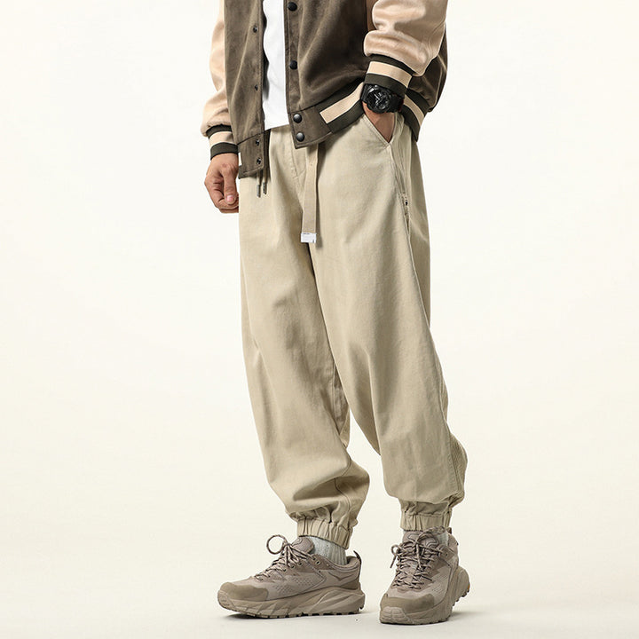 Men's wide relaxed cargo pants in jogger style with elastic tunnel drawstring waistband and cord decoration Drune