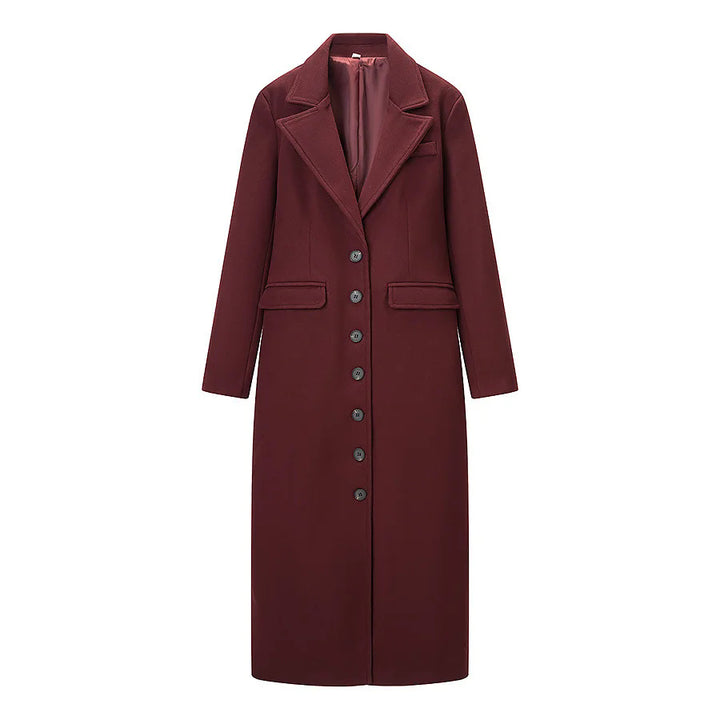 Women's figure-hugging knee-length coat with shawl collar, full button placket and flap pockets Mune Fashion