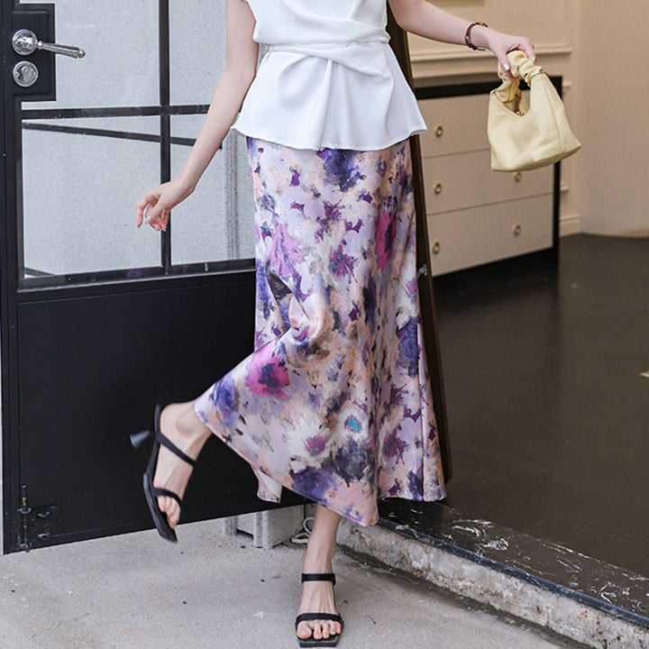 Women's elegant A-line midi skirt with watercolor floral print and fine satin look.