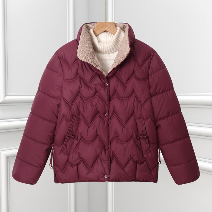 Women's short quilted puffer jacket with decorative curved quilting and snap button placket Mune Fashion