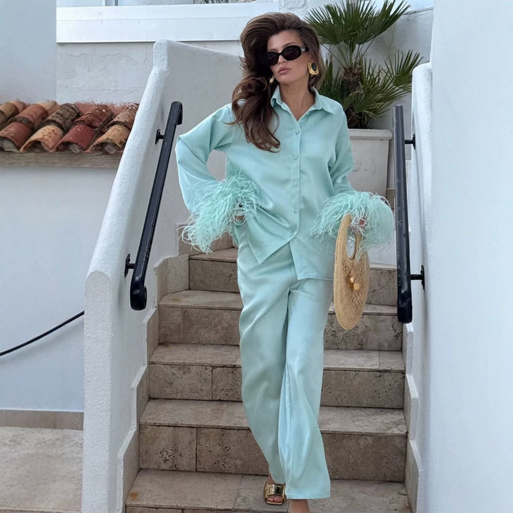 Ladies two-piece satin set with feather trim at the cuffs Mune Fashion