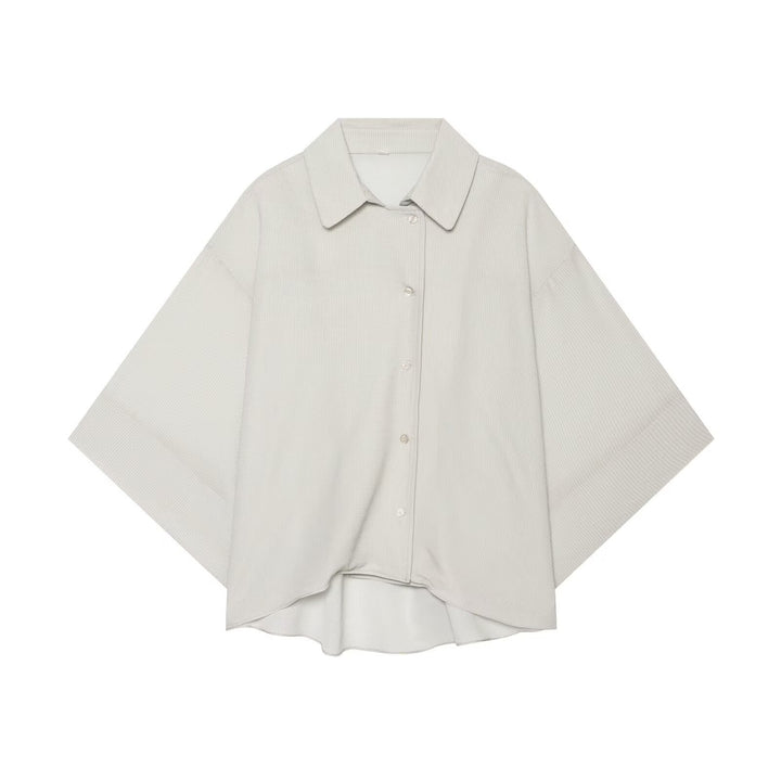 Women's oversized shirt blouse with waffle texture, boxy silhouette, and high-low hem
