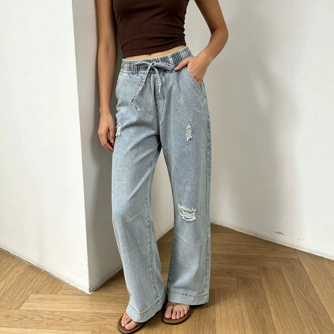 Women's wide denim pants with elastic drawstring waistband, used effects and relaxed fit Mune Fashion