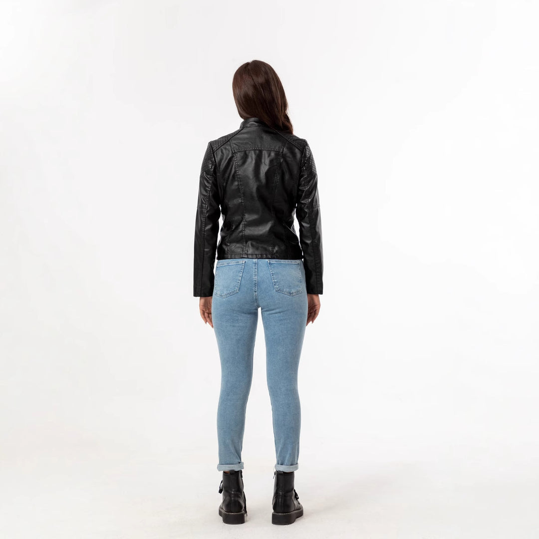 Ladies tailored faux leather biker jacket with quilted shoulder section, asymmetrical zipper and decorative eyelets Mune Fashion