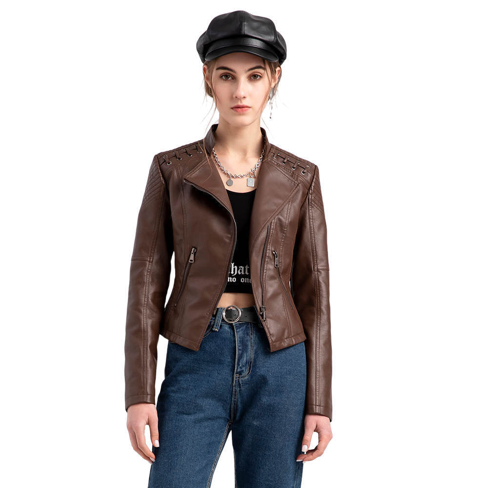 Women's short biker jacket made of faux leather with decorative eyelet lacing on the shoulders Mune Fashion