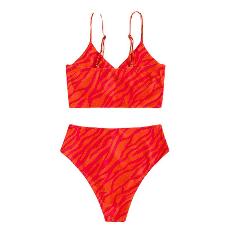 Women's bikini set with flattering wrap design and sporty animal print drape