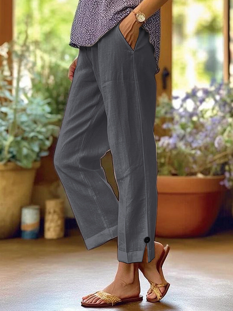 Women's linen trousers with a relaxed, ankle-length fit, side pockets and decorative button details Mune Fashion