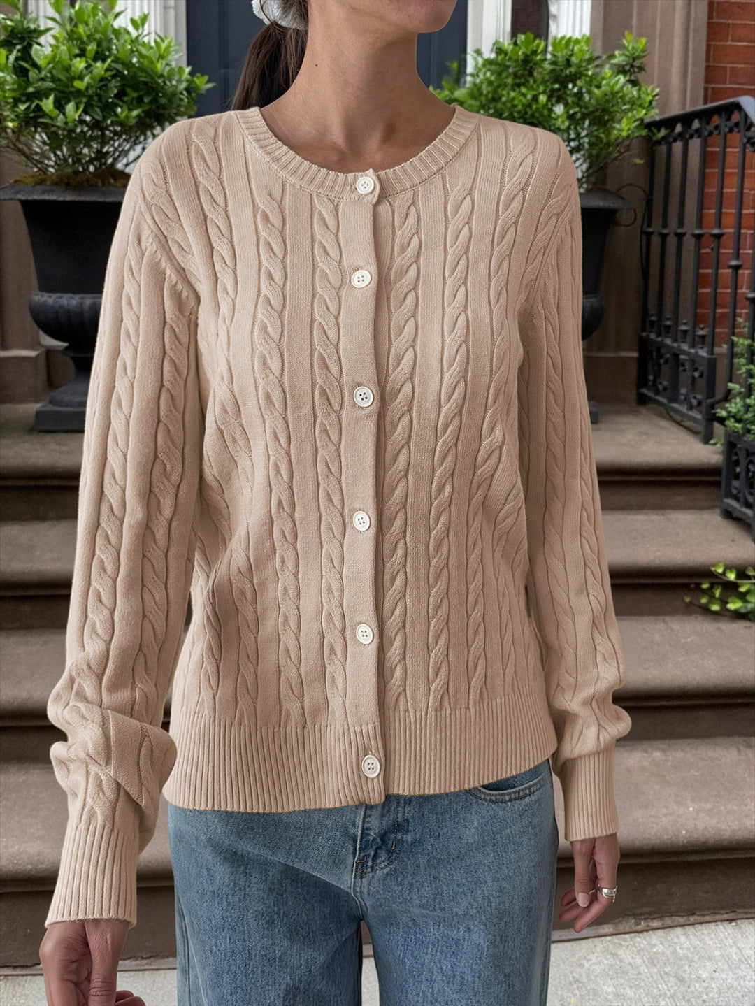 Women's cable knit cardigan with round neckline, button placket and ribbed hem Mune Fashion