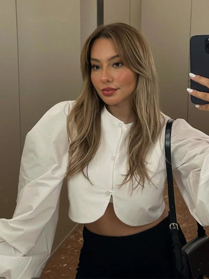 Women short-cut blouse with curved hem edge and voluminous puff sleeves Mune Fashion