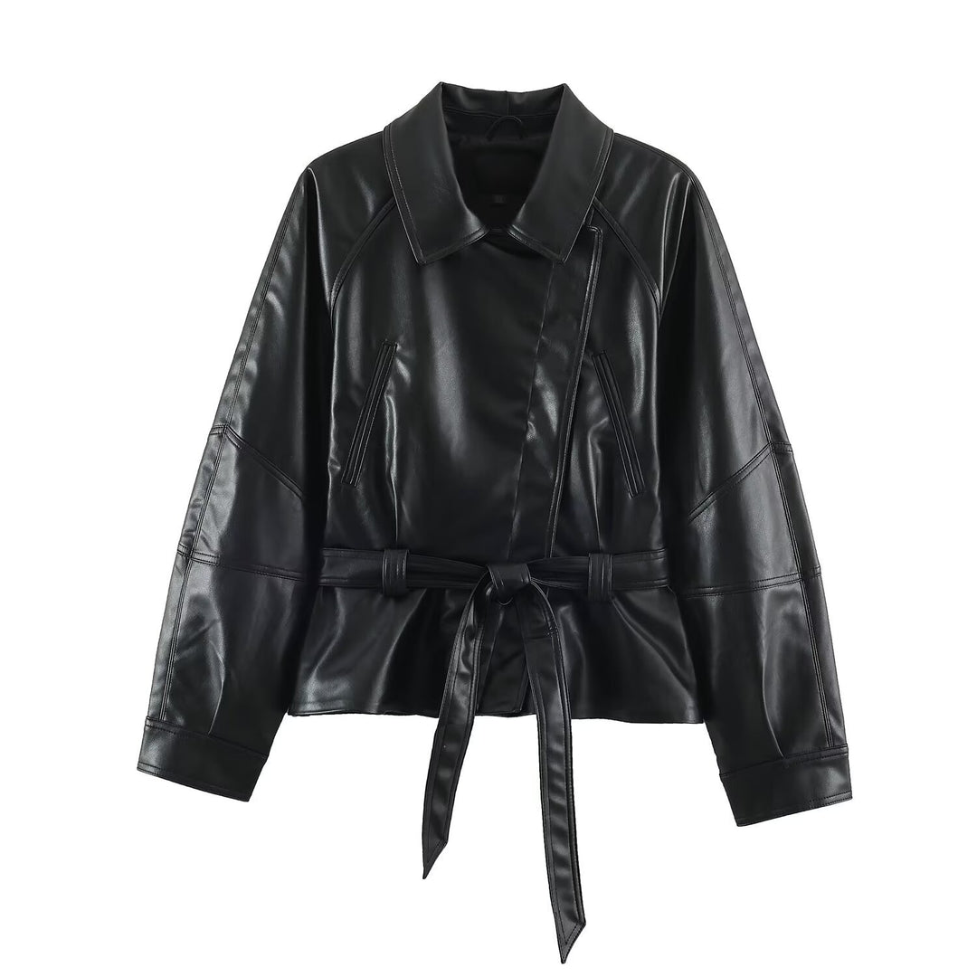 Women’s short jacket made of faux leather with a waist belt and oversized sleeves Mune Fashion