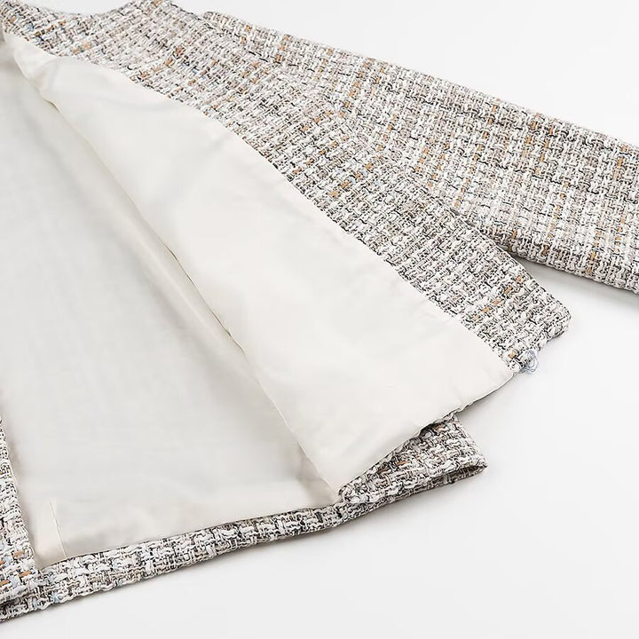 Ladies short jacket made of bouclé tweed with a round neckline and decorative gold buttons Mune Fashion