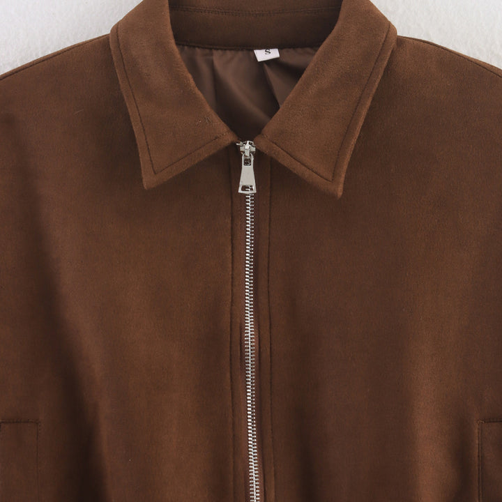 Women's cropped bomber jacket in velour look with shirt collar, sleeve pocket, and fitted ribbed waistband.