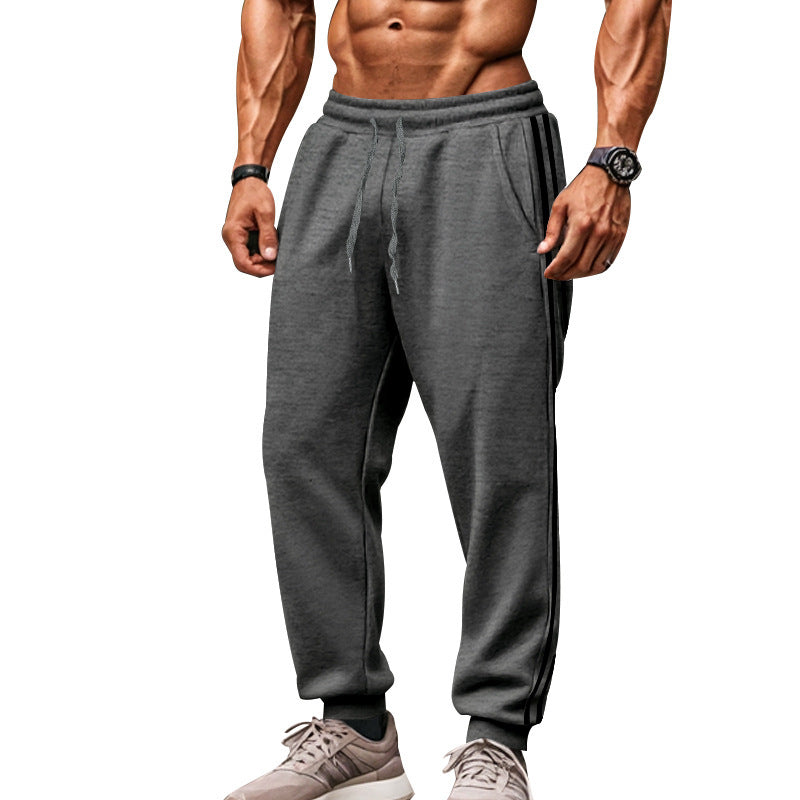 Men's sporty jogging pants with side contrast stripes, elastic drawstring waistband, and ribbed leg endings Mune Fashion