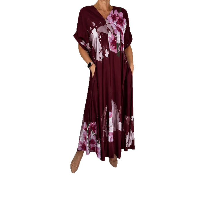 Women's maxi dress with a flowing fall, V-neck, side pockets, and floral watercolor look Mune Fashion