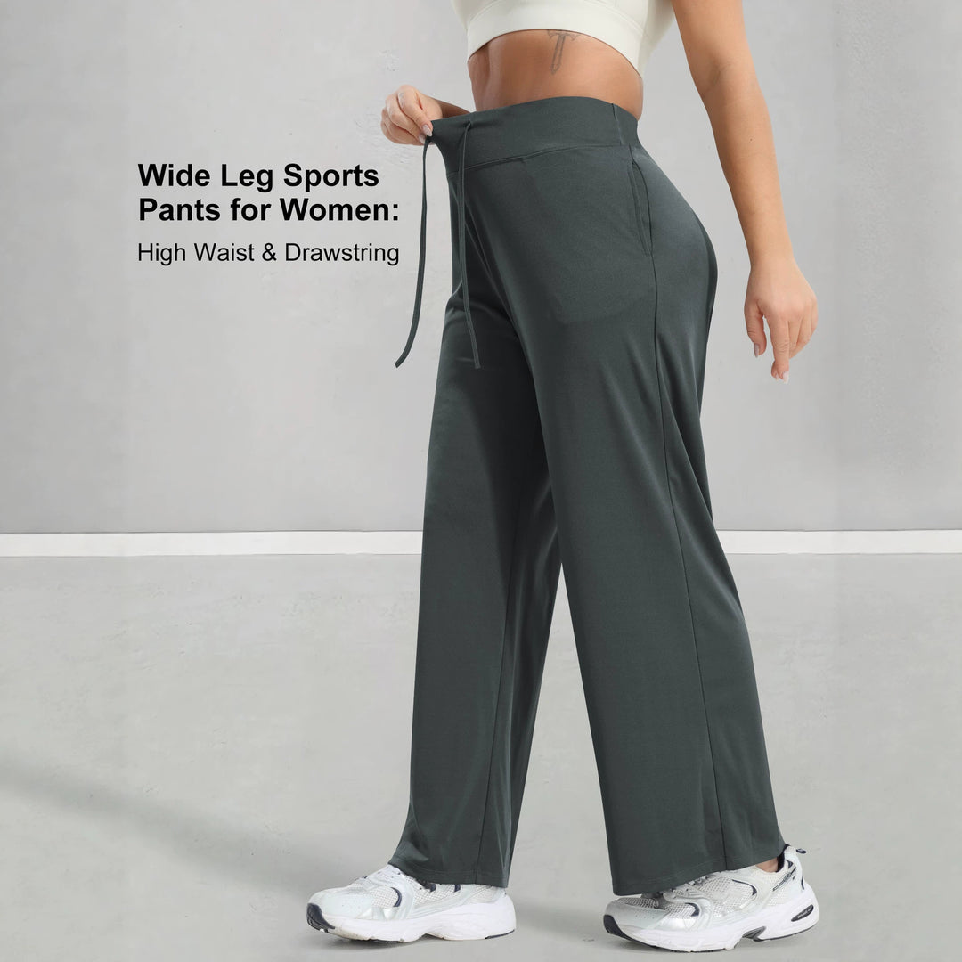 Women's jogging pants with high waistband, wide leg, drawstring, and side pockets Mune Fashion