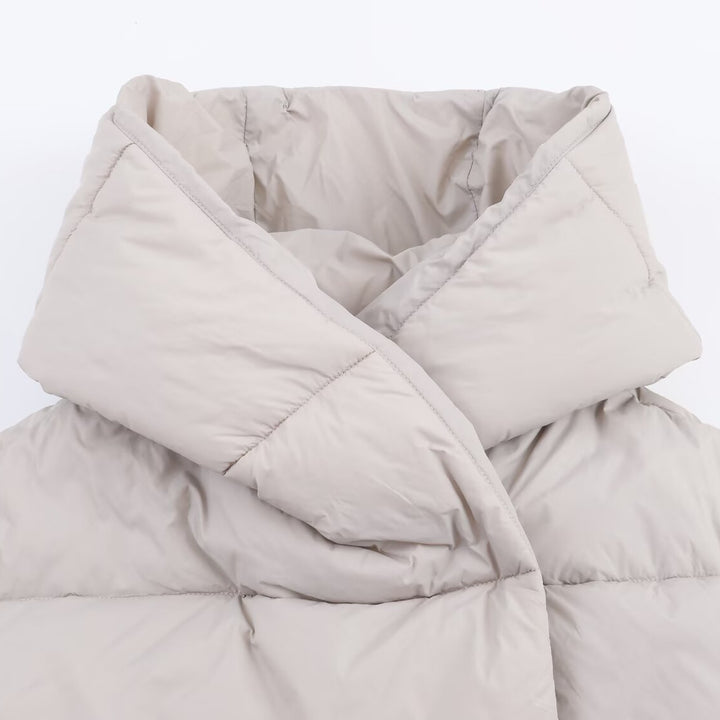 Women short cut oversized quilted jacket with high wrap collar and padded lining Mune Fashion