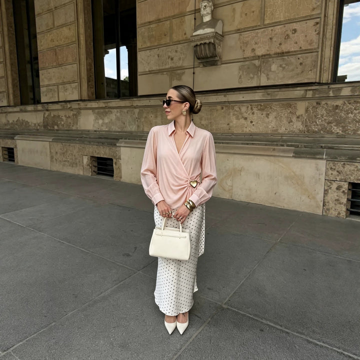 Women's wrap blouse made of silky crepe with draping, deep V-neckline, and gold decorative button Mune Fashion