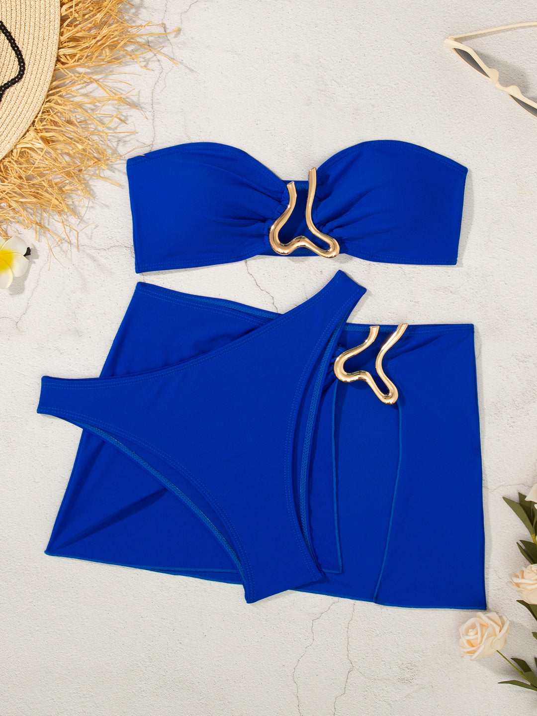 Women's bandeau bikini set with stylish skirt detail and golden accents Mune Fashion