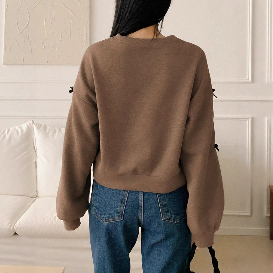 Women’s Oversize Sweatshirt with Decorative Bow Sleeves and Round Neckline Mune Fashion