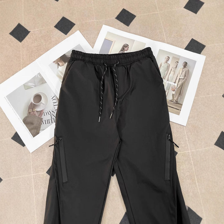 Unisex sporty jogging pants with adjustable waistband and side pockets Mune Fashion