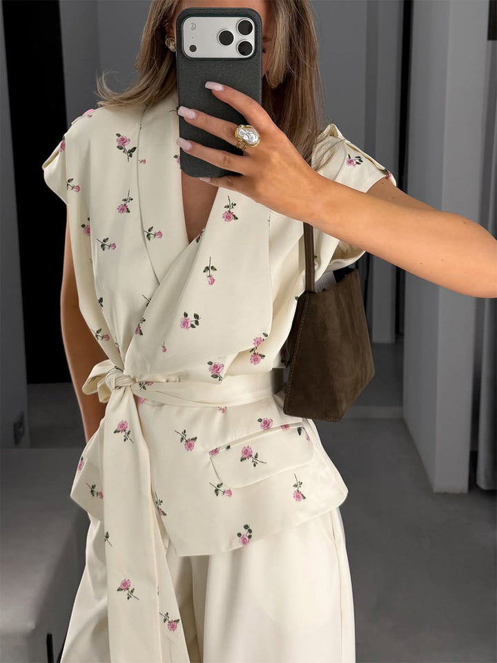 Women's sleeveless wrap blouse with fitted tie belt and patch pockets Mune Fashion