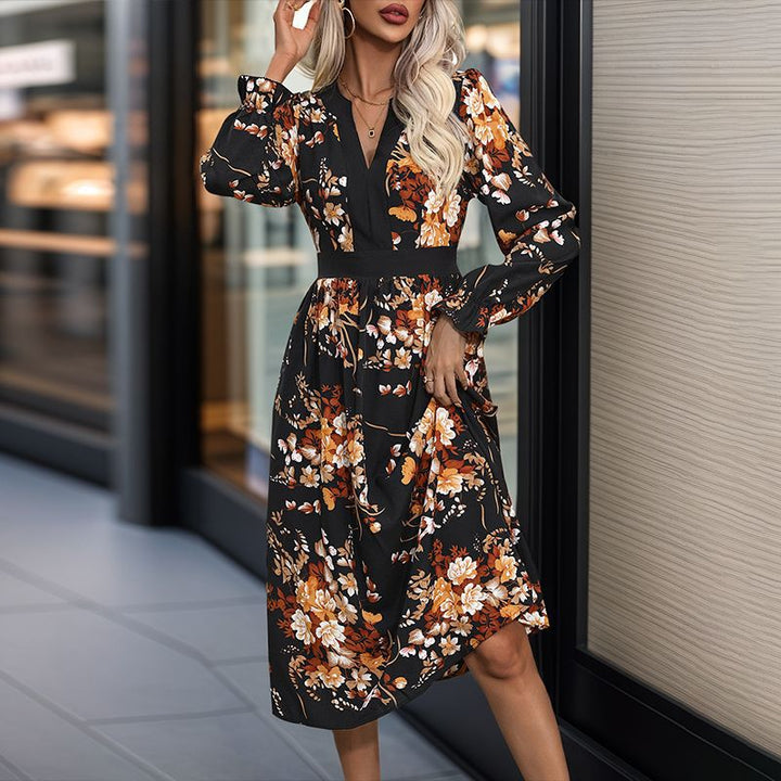 Women’s midi dress with fitted waist, V-neck, long sleeves, and floral all-over print Mune Fashion