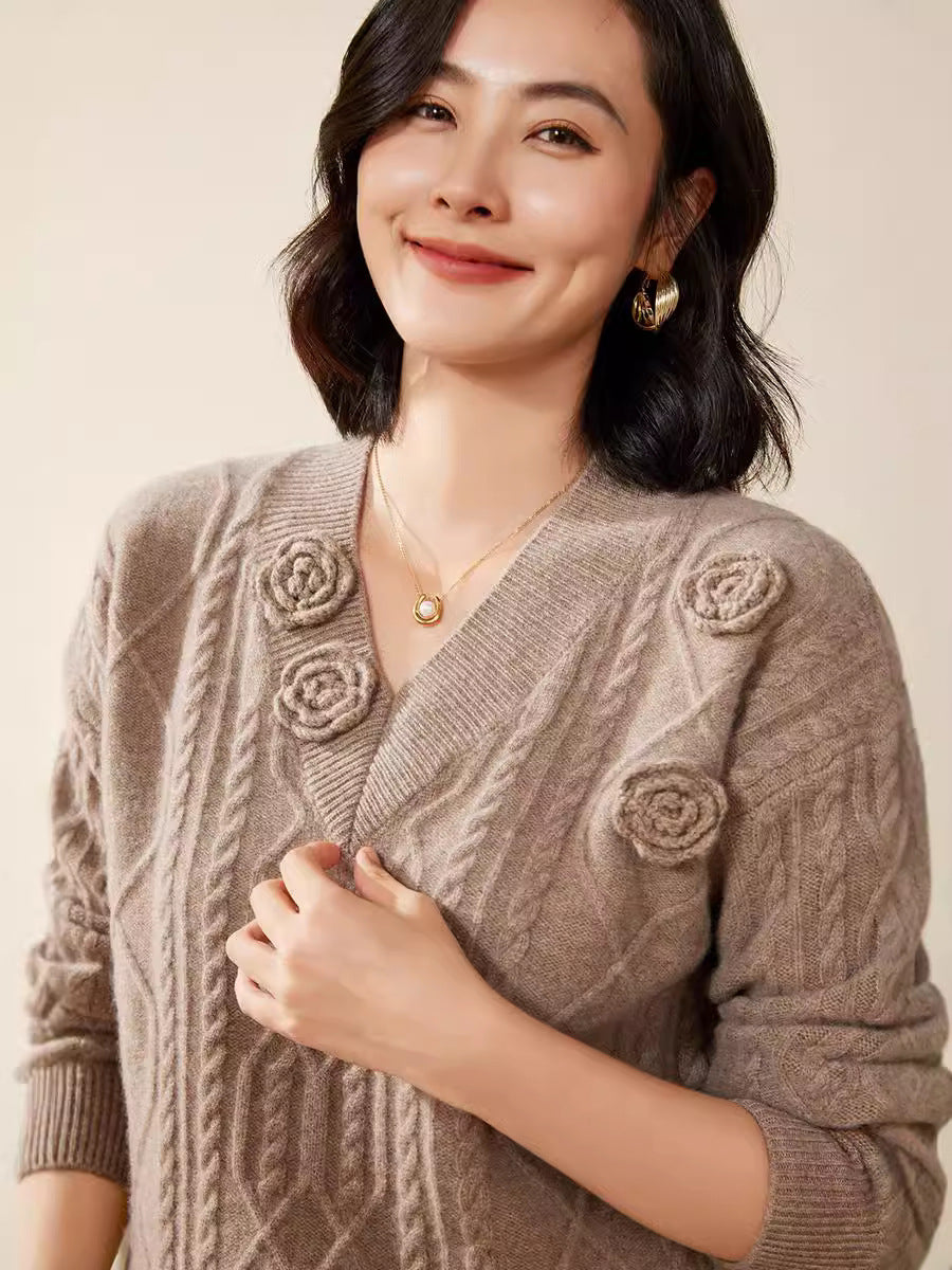 Women's cable knit V-neck sweater with three-dimensional floral appliqués made from soft wool blend Mune Fashion