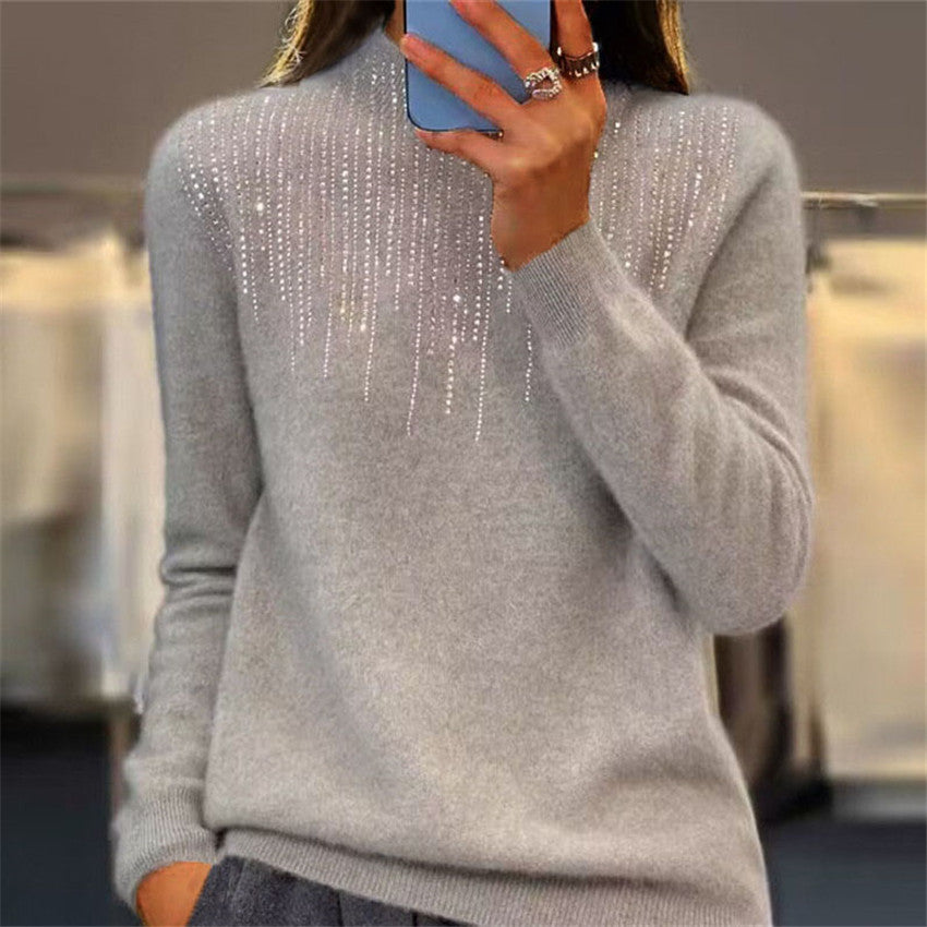 Women's cozy fine knit sweater with subtle rhinestone embellishment at the round neckline and ribbed hem Mune Fashion