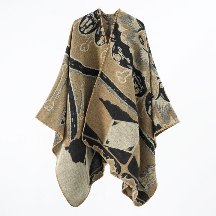 Women's statement cape poncho made from jacquard woven wool blend with skull and bone pattern Mune Fashion