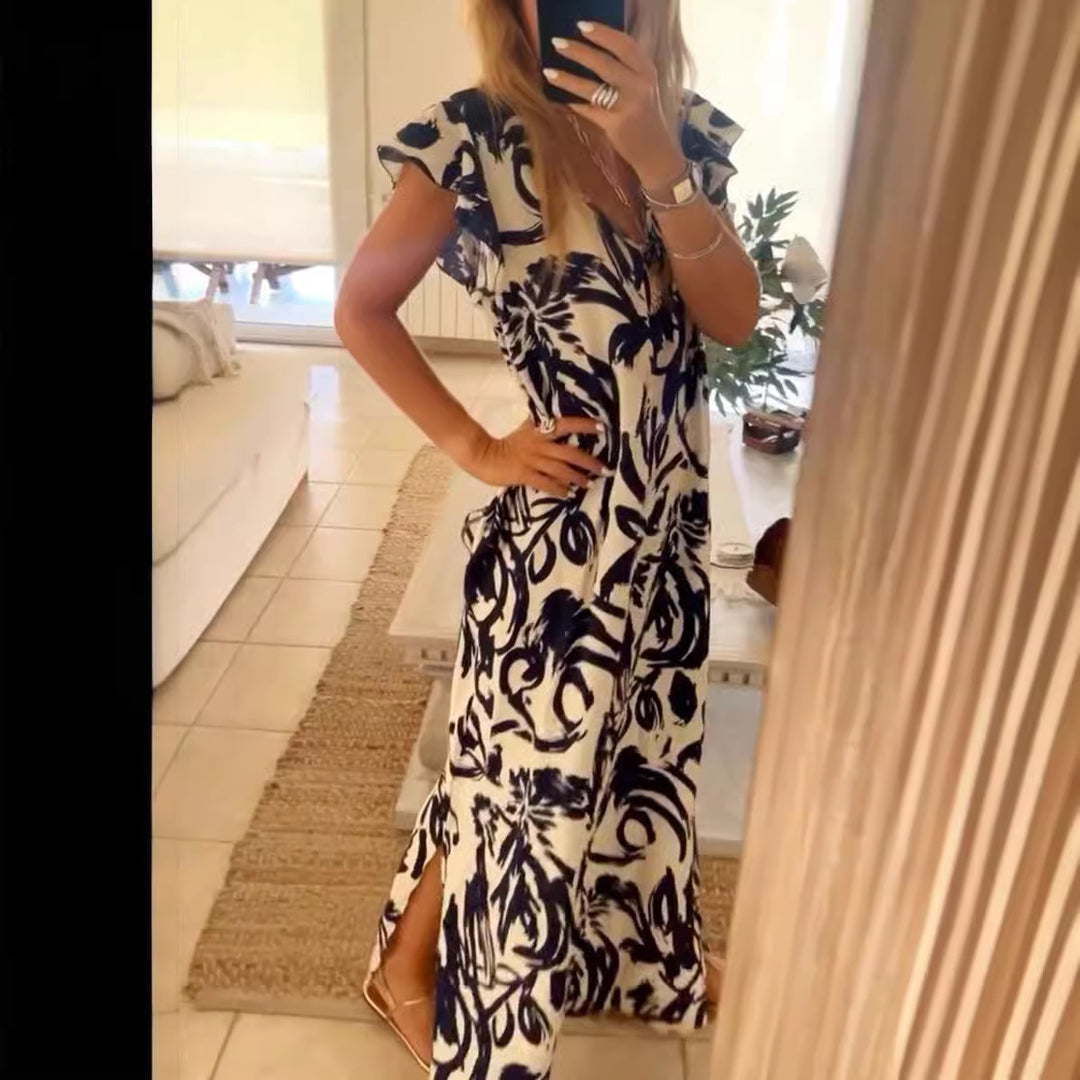 Women's flowing maxi dress with V-neck, flutter sleeves, and side leg slit Mune Fashion