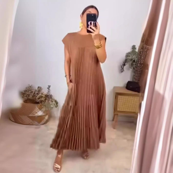 Women's flowing pleated maxi dress with dropped shoulders and side pockets Mune Fashion