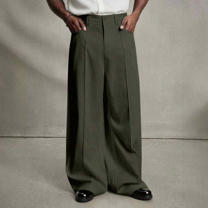 Men's wide pleated pants with high waistband, precise creases, and side inset pockets Mune Fashion