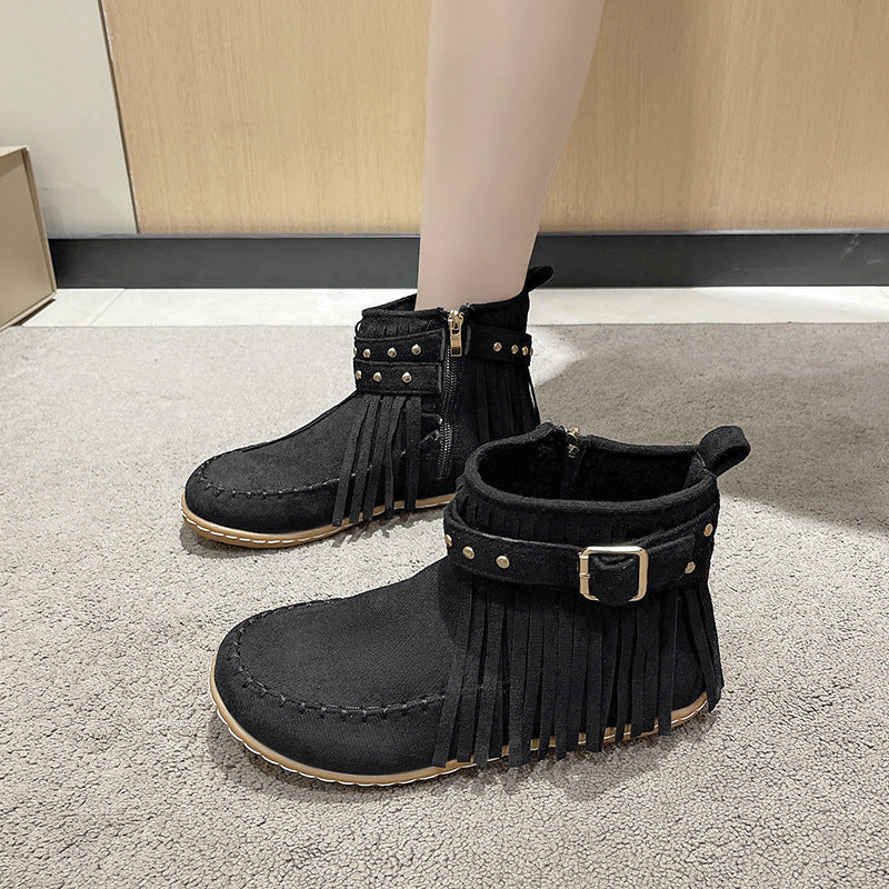 Women's fringe ankle boot in moccasin style with decorative studs, buckle strap, and side zipper Mune Fashion