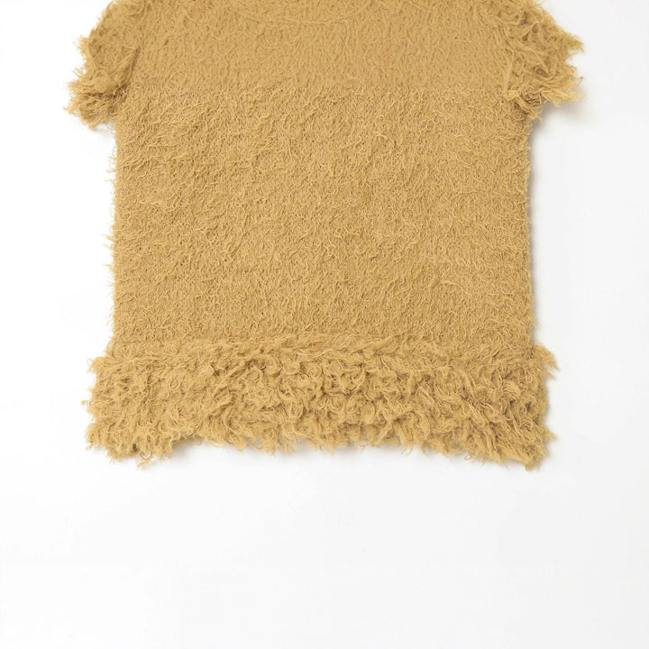 Women's fluffy sleeveless teddy top with round neckline and fringes Mune Fashion