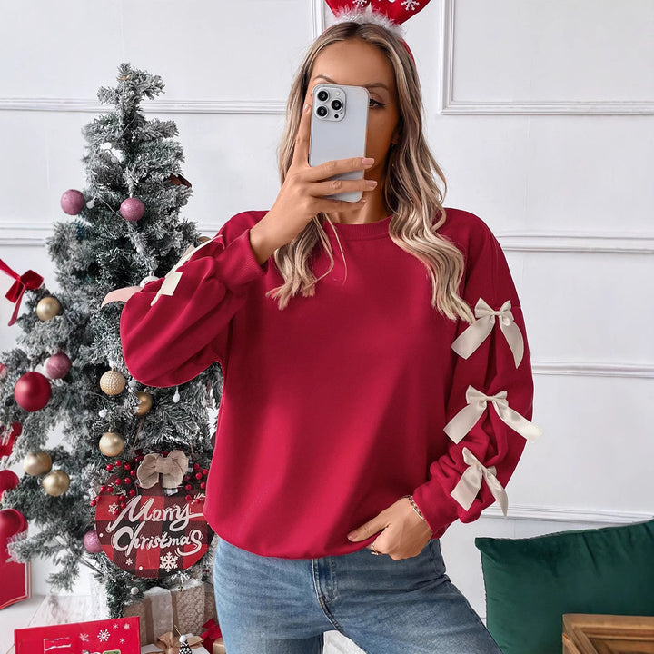Women's sweatshirt with decorative bows on the sleeves Mune Fashion