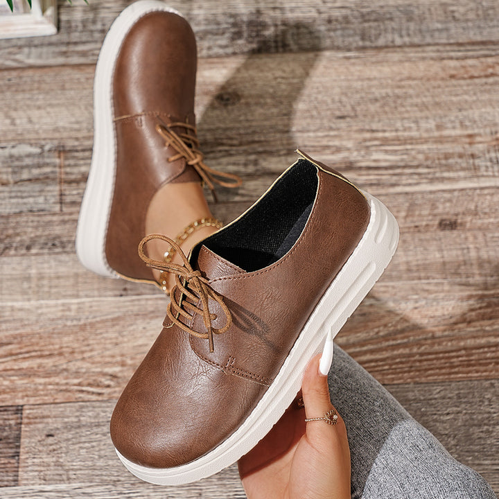 Women's lace-up sneakers made of synthetic leather with a cushioned comfort footbed and light profile sole Mune Fashion