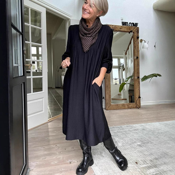 Ladies' loose midi dress with fine pleated look, stand-up collar, short button placket, smocked cuffs, and side pockets Mune Fashion