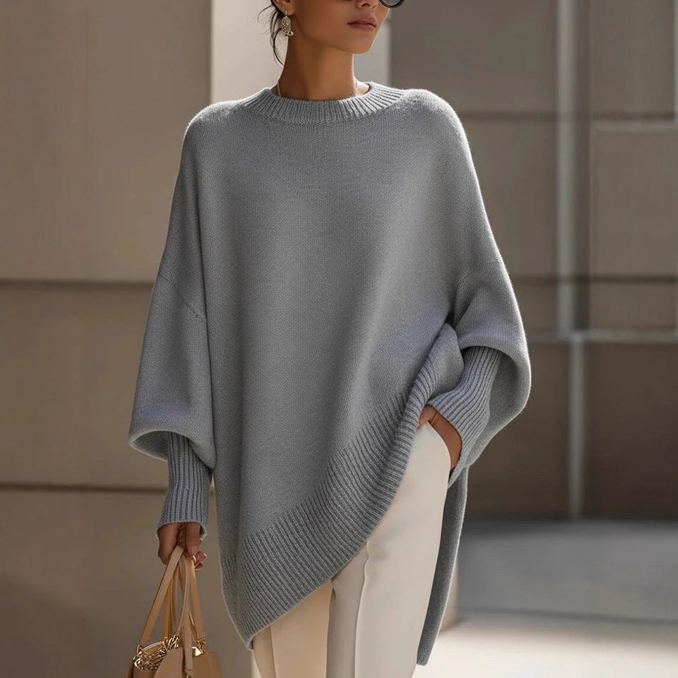 Women's oversized knit poncho with asymmetrical hem and ribbed sleeves Mune Fashion