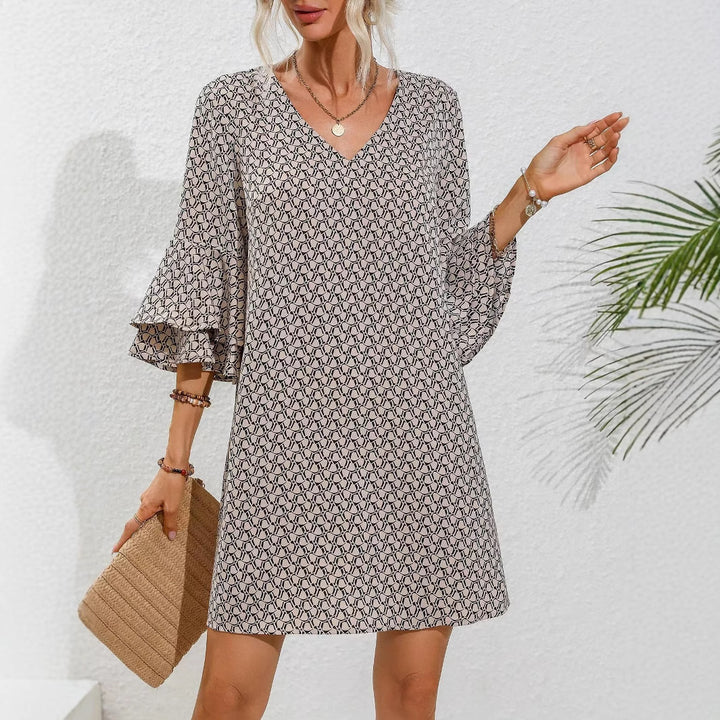 Women's flowing tunic mini dress with V-neck graphic chain pattern and double-layered bell sleeves Mune Fashion