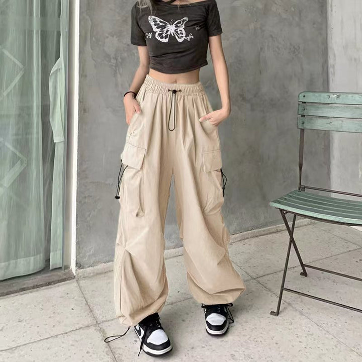 Women's wide cargo pants with tunnel drawstring, adjustable hem, and multiple pockets Mune Fashion