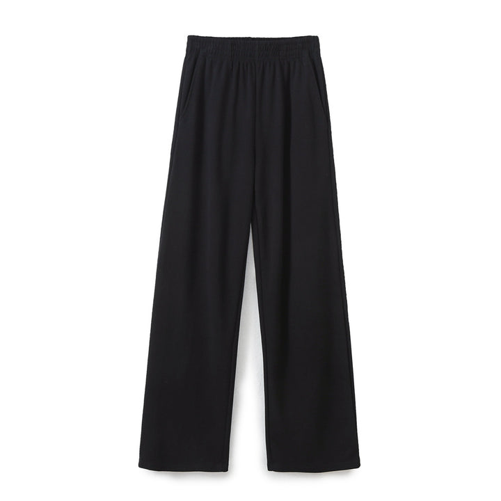 Women's wide comfort lounge pants with elastic comfort waistband, central slit and flowing palazzo silhouette Mune Fashion
