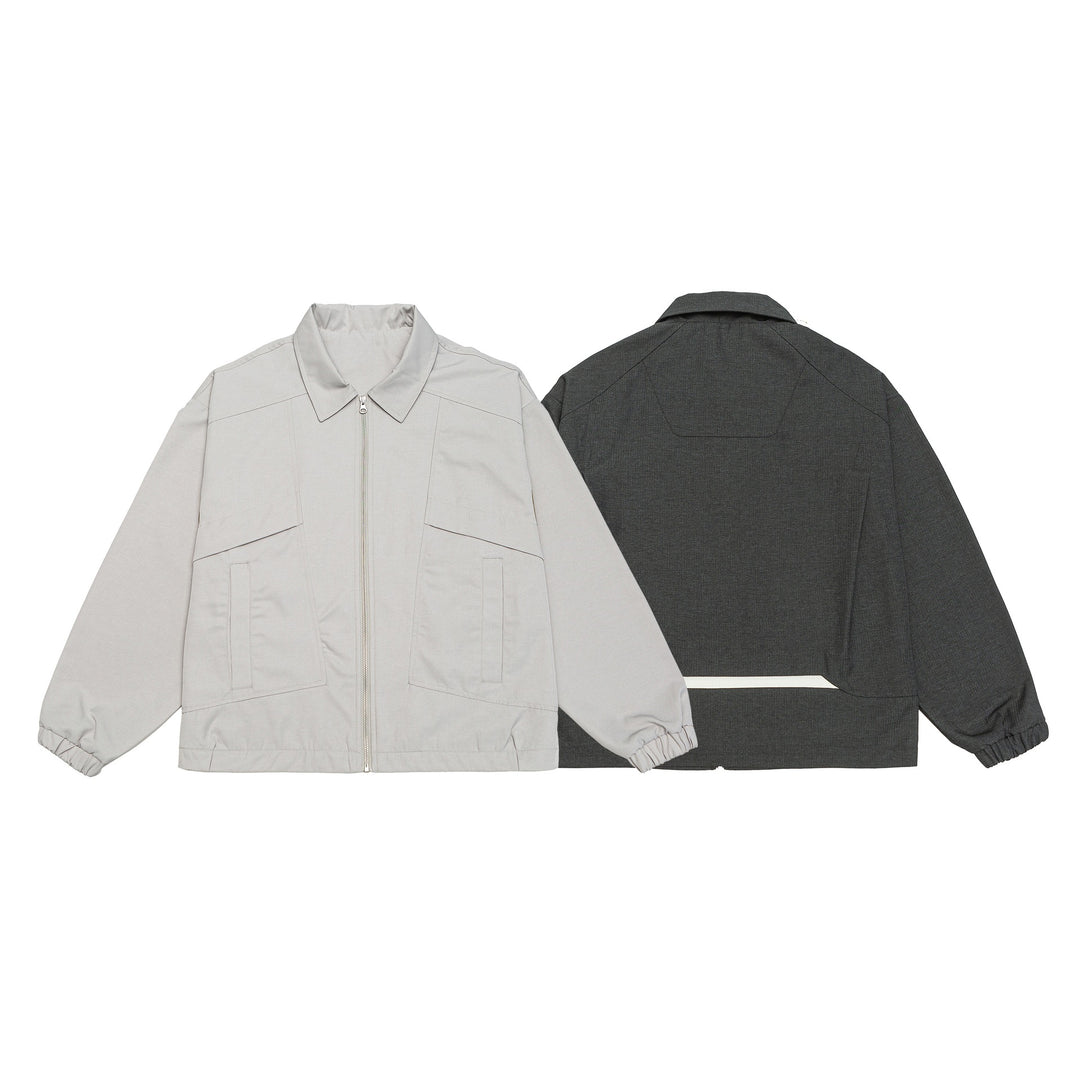 Unisex short jacket in boxy cut with shirt collar, visible metal zipper and utility patch pockets Mune Fashion