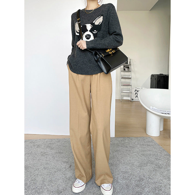 Women's high-waisted, tailored wide-leg fabric pants with pleats and extended hem
