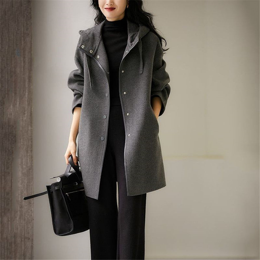 Women's mid-length wool blend coat with hood and snap button placket in oversized fit Mune Fashion